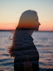 Double exposure of a woman's profile against a stunning sunset, elegantly merged with tranquil ocean waves. A captivating blend of nature, introspection, and beauty, ideal for themes of peace and drea
