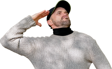 Man in cap and sweater giving a funny, exaggerated salute with a humorous facial expression, isolated on white. Perfect for concepts of respect, humor, or mock authority.