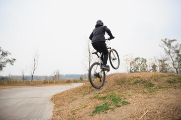 Woman freerider riding bike outdoors