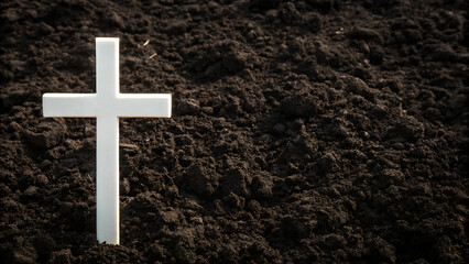 Cross in soil