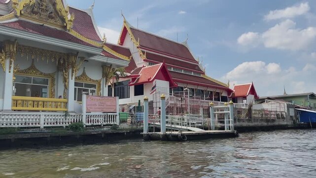 Spiritual Thai temple architecture viewed from boat on Khlong Saen Saep, Bangkok