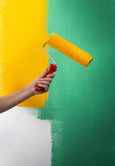 Painting a house wall with roller
