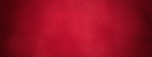 Dark red suede fabric background with matte velvet texture, wine tones and soft felt surface with vignette in macro