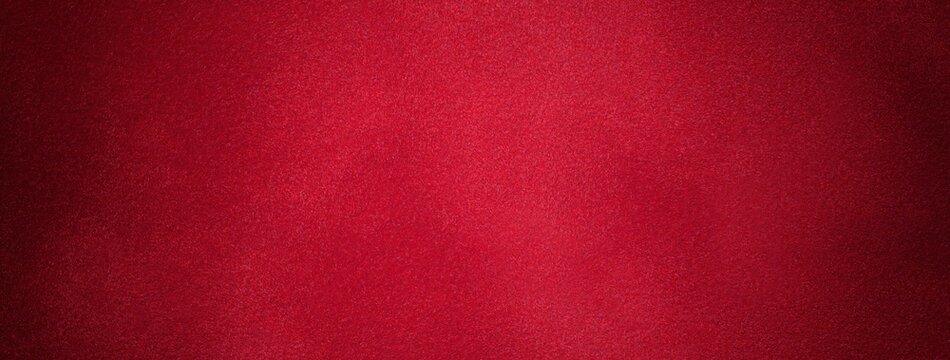 Dark red suede fabric background with matte velvet texture, wine tones and soft felt surface with vignette in macro