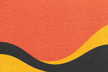 Textured warm orange paper background with black and yellow wavy lines and waves, copy space for banner, presentation