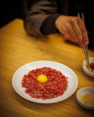 Beef Tartar being eaten in market in Seoul