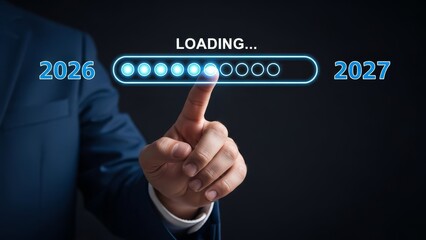 Businessman pressing a loading progress bar transitioning from 2026 to 2027