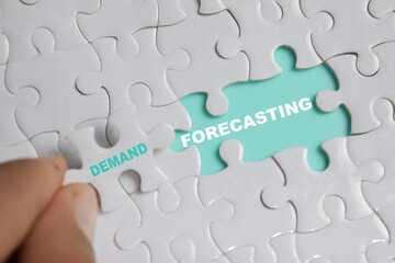 Fototapeta premium Piece of jigsaw puzzle with word demand forecasting. Business and finance concept