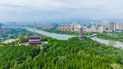 China Linqu ancient tower and urban garden architecture river landscape