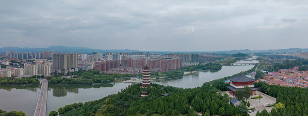 China Linqu ancient tower and urban garden architecture river landscape