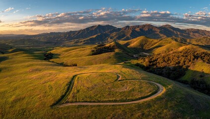 Heart-shaped path in a valley at sunset