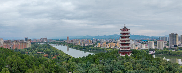 China Linqu ancient tower and urban garden architecture river landscape