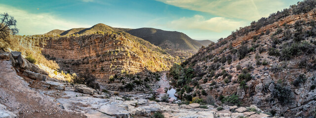 Serene Rocky Canyon Oasis With Pool, Trees, and Mountain Backdrop Under Blue Sky, Tizguan, Agadir, Morocco