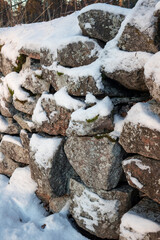 section of old snowy stone wall outdoors