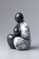 Stone sculpture of a seated figure