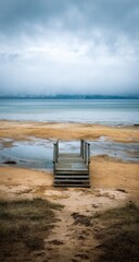 Wooden walkway leading to a hazy lake