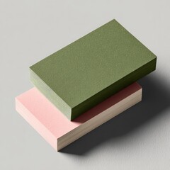 Two business cards, stacked, in muted colors