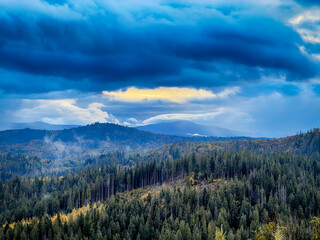 Sunny Autumn Carpathians with Puffy White During The Sunset