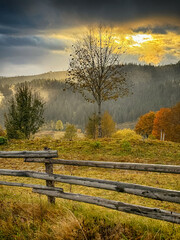 Fototapeta premium Sunny Autumn Carpathians with Puffy White During The Sunset