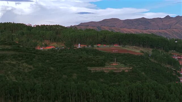 Cristo Blanco Jesus statue Cusco vive en Peru Per&uacute; aerial drone Cuzco Red Hill Saqsaywaman cityscape Peruvian Andes landscape landmark rainy season sunset Inca Empire capitol circle right motion