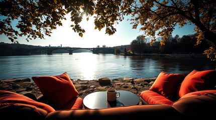 a secluded place for relaxing with a sofa, armchair, and table by the river