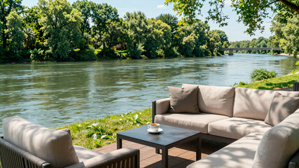 a secluded place for relaxing with a sofa, armchair, and table by the river