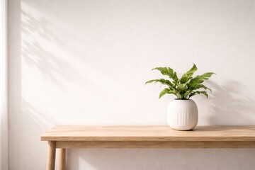 Minimalist interior scene featuring a vibrant green fern in a white ribbed ceramic vase, placed on a light wood console table against a neutral beige wall with soft window shadows.