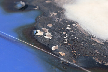 Detail an einem ausgebrannten Auto