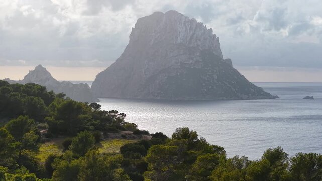 Mediterranean Sea holiday destination, aerial view of Ibiza island, Es Vedra cliff in the sea off the coast of Ibiza, drone shot of Balearic island