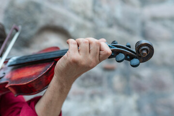 Close-up shot of the hand playing the violin.