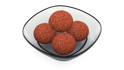 brown laddu in decorative glass bowl