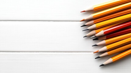 Obraz premium A vibrant collection of colored pencils artfully arranged against a clean white backdrop, representing creativity, inspiration, and artistic expression in a visual format.