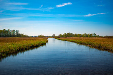 Fototapeta premium Picturesque Dutch lake, still water, and a vibrant, captivating sky