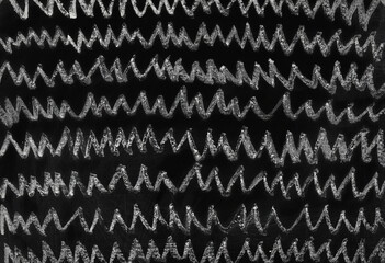 Zig zag, wavy lines, black chalkboard, old blackboard background and texture