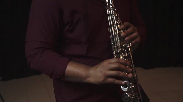 Close-Up of Musician Playing Saxophone in Studio