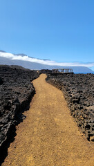 Volcanic rock path winding along west coast of Island El Hierro, Canary Islands, Spain, Europe.