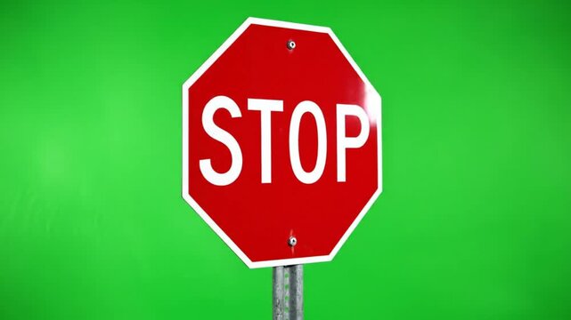 Red stop sign on green background, traffic sign, road sign, warning sign