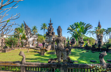 Magnificent Buddha Park (Xieng Khuan) in a meadow by the Mekong River near Vientiane, Laos