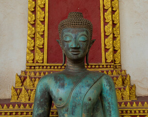 Variety of facial expressions and poses among the Buddha sculptures in the historic Ho Phra Keo temple, Vientiane, Laos