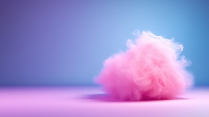 This image features a fluffy pink cotton candy against a soft gradient background, evoking nostalgia and joy, reminding us of fun fairs and sweet childhood memories.