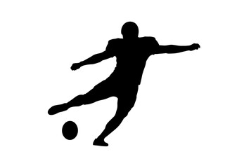 Obraz premium Silhouette of a soccer player kicking a ball in action from a side view