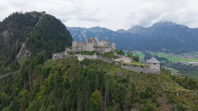 Aerial view of the ruins of Ehrenberg Castle near Highline 179. The castle stands on a peak in the mountains of Tyrol, Austria