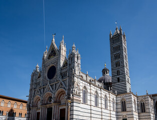 View of the streets of Siena, with its typical Tuscan architecture. Siena, Italy.