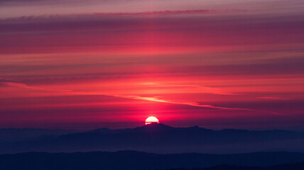 The sky turns into a canvas of reds and oranges