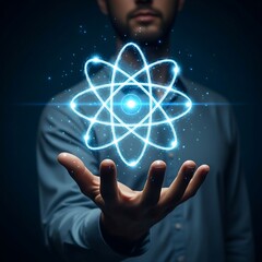 Futuristic blue atomic hologram cradled in a human hand, highlighting the mastery of technology over fundamental physical particles