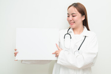 Portrait of young Asian female doctor holding white board with copy space for text