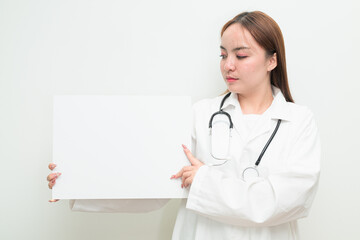 Portrait of young Asian female doctor holding white board with copy space for text