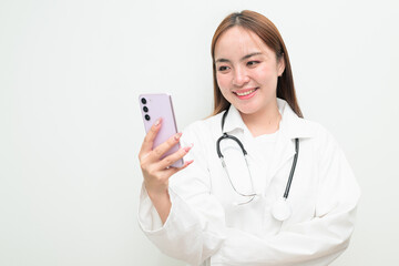 Happy Asian female doctor against white background using phone having video call smiling