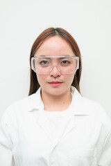 Portrait of Asian female research scientist against white background looking at camera