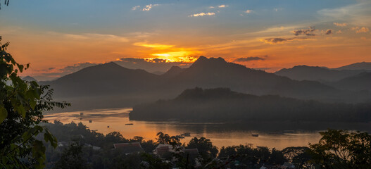 Panoramic sundown over the confluence of the Mekong and Nam Khan rivers, from the top of Mount Phousi (Mount Phu Si), Luang Prabang, Laos